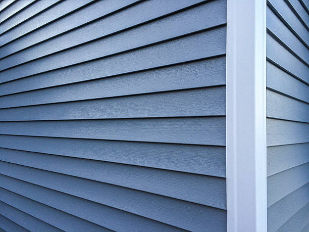 photography of new, blue vinyl siding on a home.